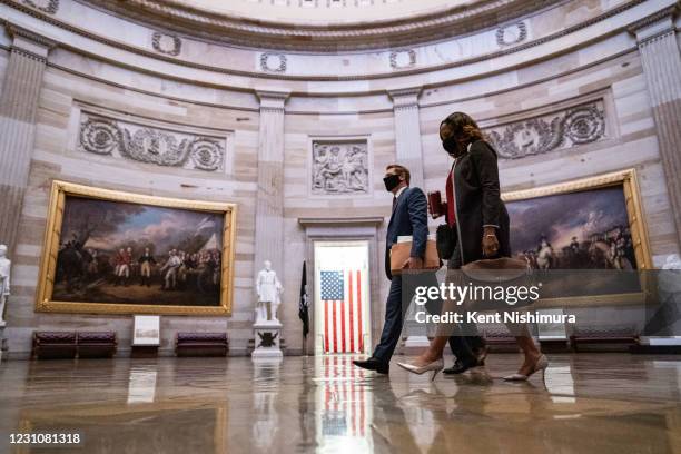 Impeachment manager Rep. Eric Swalwell and Rep. Stacey Plaskett walk through the Rotunda of the U.S. Capitol Building on Tuesday, Feb. 9, 2021 in...