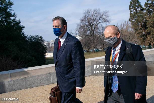 Bruce Castor and David Schoen, defense attorneys for former President Donald Trump, walk to the U.S. Capitol on February 10, 2021 in Washington, DC....