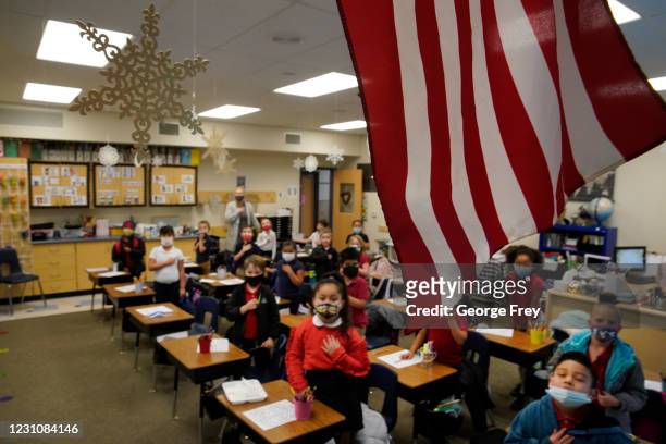Students recite the Pledge of Allegiance before school at Freedom Preparatory Academy on February 10, 2021 in Provo, Utah. Freedom Academy has done...