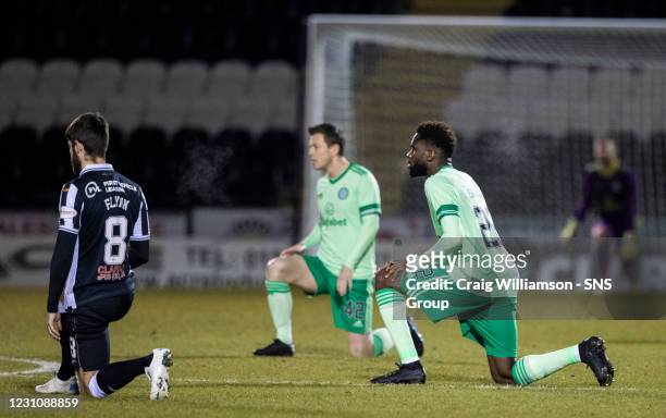 Both sets of players take the knee to support the ongoing Black Lives Matter movement during a Scottish Premiership match between St Mirren and...