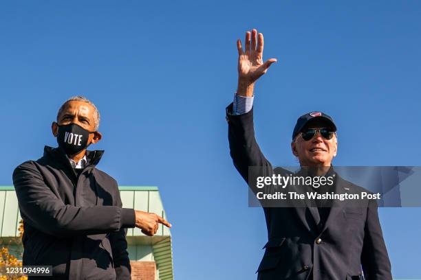 Former Vice President and presidential nominee Joe Biden and President Barrack Obama on stage during a mobilization event at Northwestern High School...