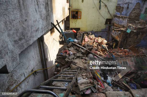 View of debris after the collapse of a building at Sadar Bazar on February 9, 2021 in New Delhi, India. A single storey building, believed to be over...