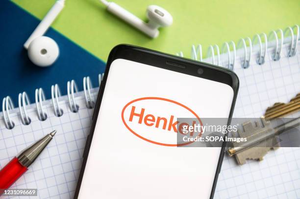 In this photo illustration, a Henkel logo seen displayed on a smartphone Henkel.