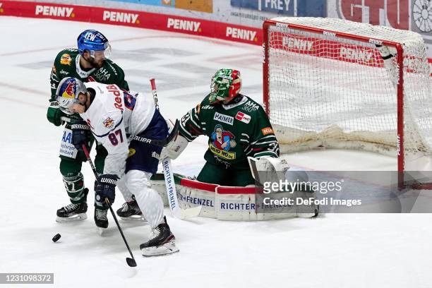 Wade Bergmann of Augsburger Panther, Philip Gogulla of EHC Red Bull Muenchen and Oliver Roy of Augsburger Panther battle for the puck during the DEL...