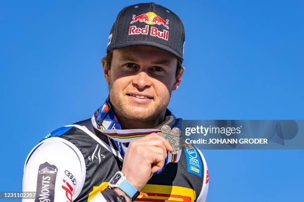 France's Alexis Pinturault poses with his bronze medal during the awarding ceremony after the Men's Super G event on February 11, 2021 during the FIS...