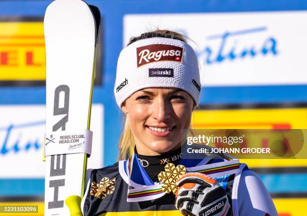 Switzerland's Lara Gut Behrami poses with her gold medal on the podium after winning the Women's Super G event on February 11, 2021 during the FIS...