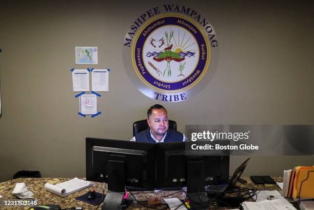 Nelson Andrews Jr, Emergency Management Director for the Mashpee Wampanoag Tribe, sits at his desk at the tribe's government center in Masphee, MA on...