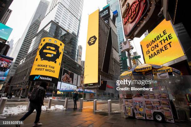 Monitors display Bumble Inc. Signage during the company's initial public offering in front of the Nasdaq MarketSite in New York, U.S., on Thursday,...