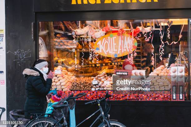 The window decoration of a backery for Carnival is seen at women day of carnival in Cologne as official carnival celebration this year is cancelled...