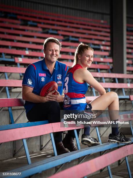 Isabella Grant of the Bulldogs poses for a photograph with her father Chris after being named for her first match at Whitten Oval on February 11,...