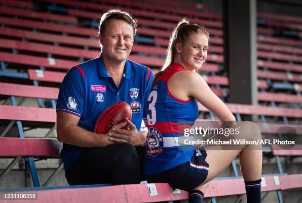 Isabella Grant of the Bulldogs poses for a photograph with her father Chris after being named for her first match at Whitten Oval on February 11,...