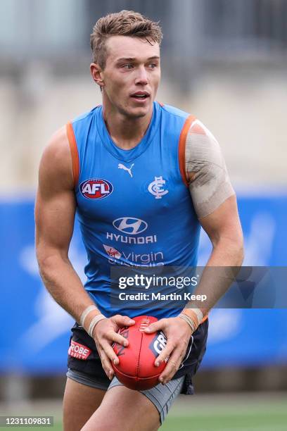 Patrick Cripps of the Blues runs with the ball during a Carlton Blues AFL Training Session at Princes Park on February 12, 2021 in Melbourne,...