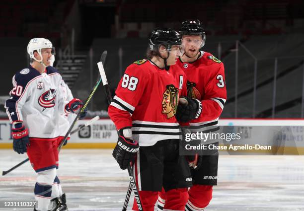 Carl Soderberg of the Chicago Blackhawks talks with Patrick Kane of the Chicago Blackhawks during the third period against the Columbus Blue Jackets...