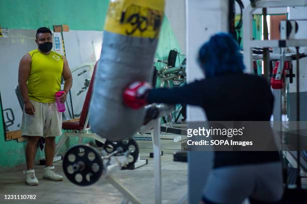 Jaqueline Hernandez trains with her coach inside a gymnasium in Jesús María, El Marqués. Jaqueline Hernandez, an amateur boxer from Queretaro, has...