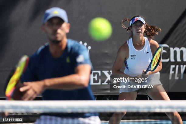 Japan's Ena Shibahara and her partner Ben McLachlan play their mixed doubles match against Germany's Kevin Krawietz and Laura Siegemund on day five...