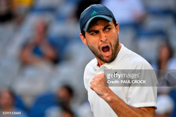 Russia's Aslan Karatsev celebrates a point against Argentina's Diego Schwartzman during their men's singles match on day five of the Australian Open...