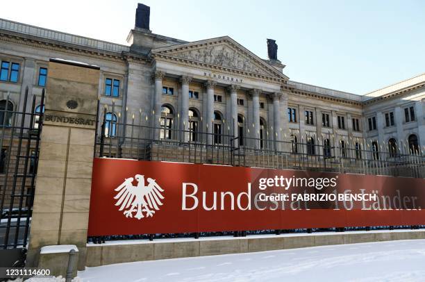 Outside view taken on on February 12, 2021 in Berlin, shows the Bundesrat building, housing the upper house of Parliament, with a banner reading...