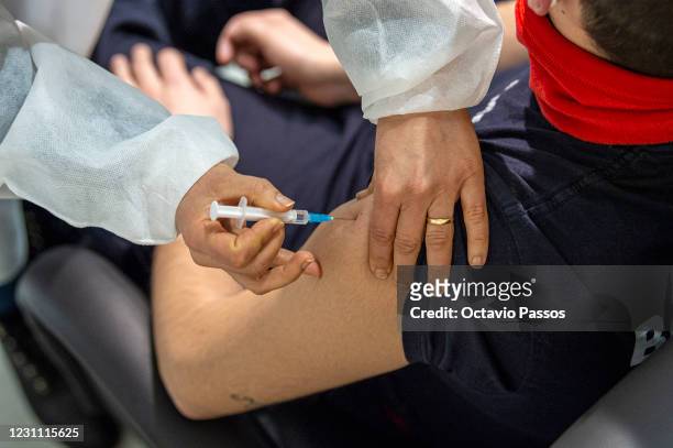 Firefighter receives the vaccine on the day in which health personnel in line for immunity are being inoculated with the AstraZeneca vaccine at...