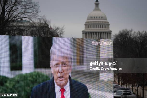 Video billboard calling for the conviction of former U.S. President Donald Trump plays near the U.S. Capitol on the fourth day of former President...