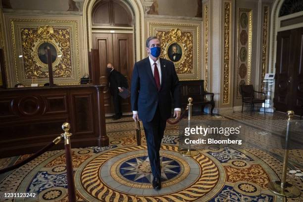 Bruce Castor, defense attorney for Donald Trump, wears a protective mask while walking through the Senate Reception Room corridor at the U.S. Capitol...