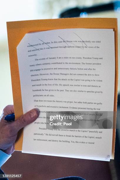 Notes of Sen. Bill Cassidy, are seen as he talks with staff in the Senate Reception room on the fourth day of the Senate Impeachment trials for...