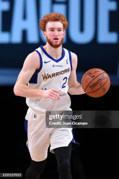 Nico Mannion of the Santa Cruz Warriors handles the ball against the Delaware Blue Coats on February 12, 2021 at AdventHealth Arena in Orlando,...