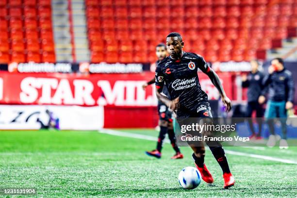 Fabian Castillo of Tijuana drive the ball during the 6th round match between Club Tijuana and Leon as part of the Torneo Guard1anes 2021 Liga MX at...