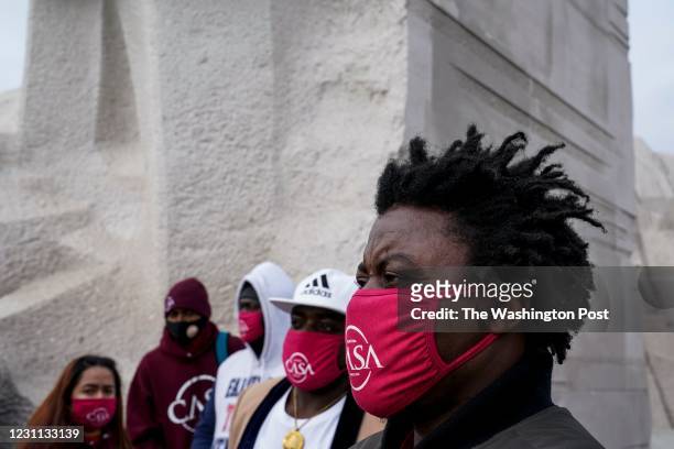 Charles Lwanga, R, of Cameroon, is among the crowd gathered at the Martin Luther King Jr Memorial to remember the Black immigrants who have been...