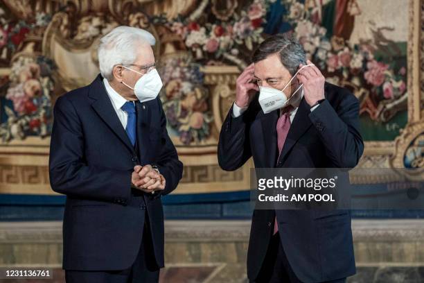 Italian President Sergio Mattarella and Italian Prime Minister Mario Draghi pose for a picture after the swearing-in ceremony at the Quirinal palace,...