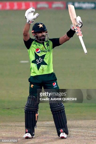 Pakistan's Mohammad Rizwan celebrates after scoring a half century during the second T20 international cricket match between Pakistan and South...