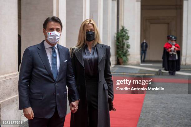 Italian outgoing Prime Minister, Giuseppe Conte and his partner Olivia Paladino, leave Palazzo Chigi following a formal handover ceremony with...