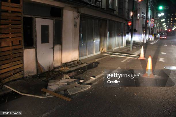 Damaged buildings are seen in Fukushima on February 13, 2021 after a strong 7.1-magnitude earthquake struck late off the eastern coast of Japan but...