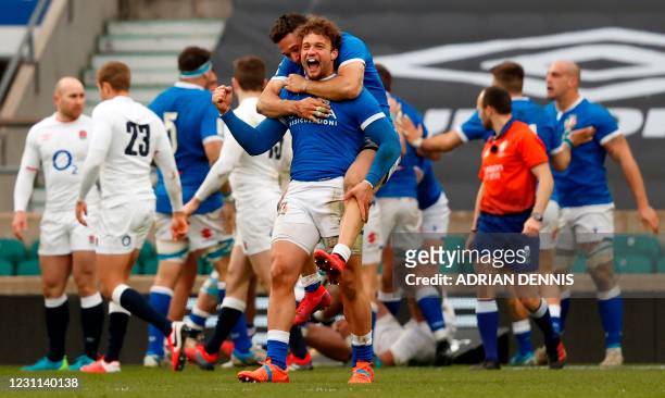 Italy's Federico Mori and Italy's wing Monty Ioane celebrate after Italy's Tommaso Allan scored his team's second try during the Six Nations...