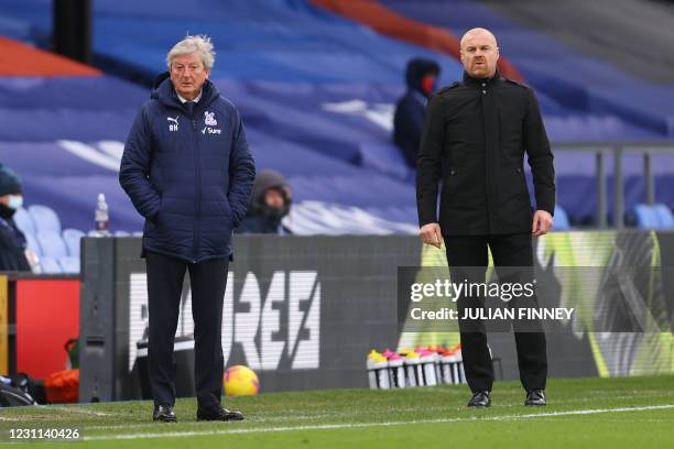 Crystal Palace's English manager Roy Hodgson and Burnley's English manager Sean Dyche look on from the side-lines during the English Premier League...
