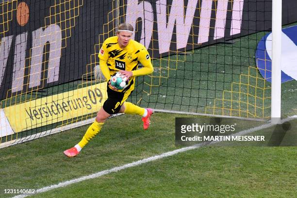Dortmund's Norwegian forward Erling Braut Haaland celebrates scoring the team's 2-2 goal during the German first division Bundesliga football match...