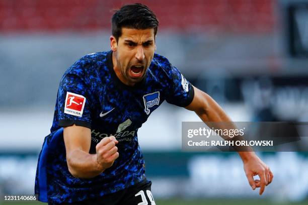 Hertha Berlin's German midfielder Sami Khedira celebrates after his teammate scored during the German first division Bundesliga football match...