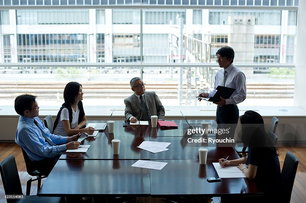Businessmen who is conferring in office