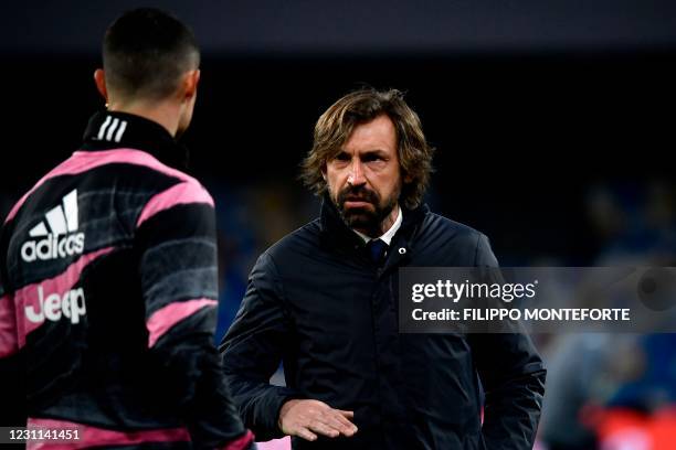 Juventus' Italian coach Andrea Pirlo talks to Juventus' Portuguese forward Cristiano Ronaldo prior to the Italian Serie A football match Napoli vs...