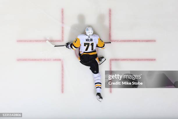 Evgeni Malkin of the Pittsburgh Penguins stretches prior to the game against the New York Islanders at Nassau Coliseum on February 11, 2021 in...