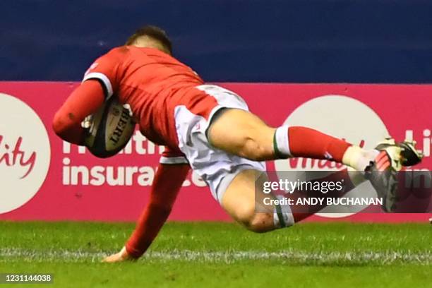 Wales' wing Liam Williams goes over for Wales' second try during the Six Nations international rugby union match between Scotland and Wales at...