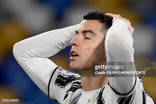 Juventus' Portuguese forward Cristiano Ronaldo reacts after missing a goal opportunity during the Italian Serie A football match Napoli vs Juventus...