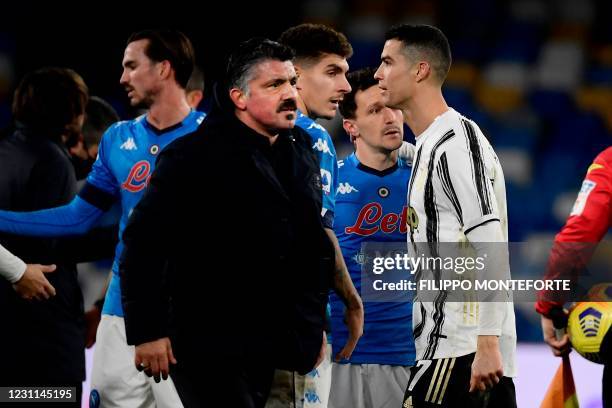 Napoli's Italian coach Gennaro Gattuso reacts with his players as Juventus' Portuguese forward Cristiano Ronaldo leaves the pitch at the end of the...