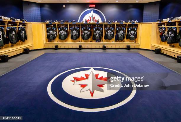 Canadian Armed Forces themed jerseys hang in the locker room prior to NHL action between the Winnipeg Jets and the Ottawa Senators at the Bell MTS...