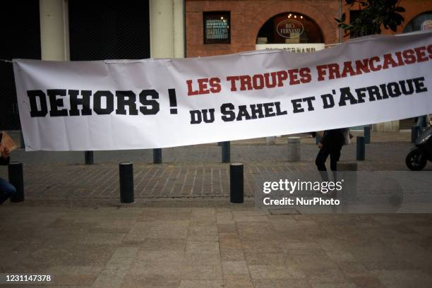 The banner reads 'Get Out ! French military in Sahel and Africa'. People gathered in protest against the presence of French soldiers in Mali and...