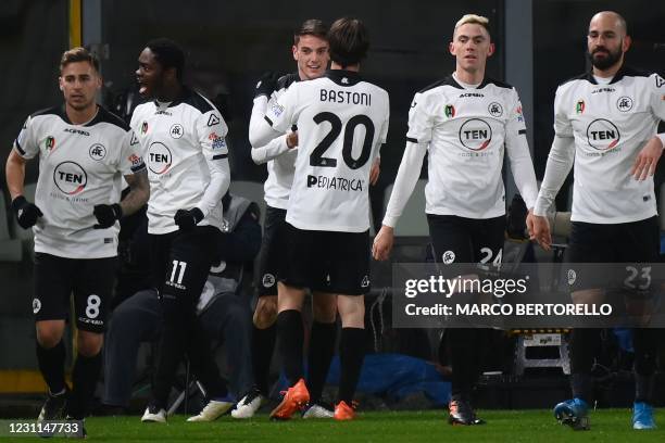 Spezia's Italian midfielder Giulio Maggiore celebrates with teammates after opening the scoring during the Italian Serie A football match Spezia vs...