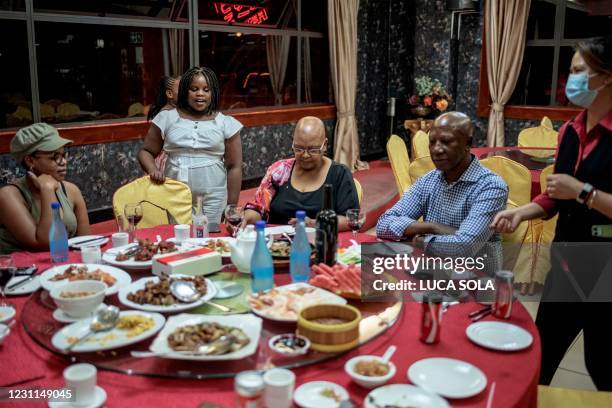 South African family enjoys a typical Chinese new years day dinner at Shun De restaurant in Johannesburg Chinatown, in Cyrildene, on February 13 the...