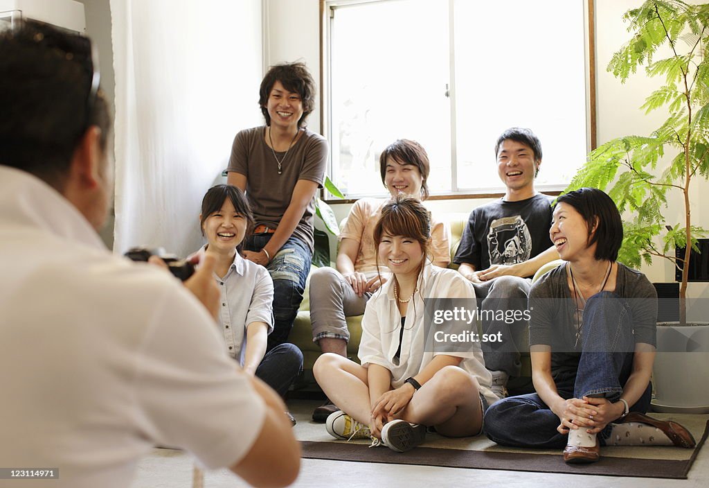 Group of young friends having photograph taken