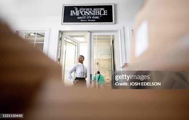 Reign Free, Founder and CEO of The Red Door Group catering company, stands for a photo at her office in Oakland, California on February 12, 2021. -...