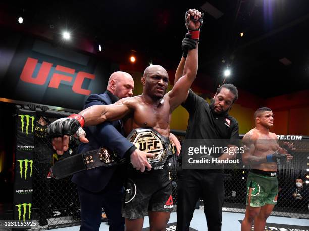 In this handout image provided by UFC, Kamaru Usman of Nigeria reacts after his victory over Gilbert Burns of Brazil in their UFC welterweight...