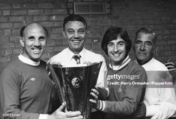 Members of the Liverpool backroom staff celebrate with the trophy after the UEFA Cup Final 2nd Leg between Club Brugge and Liverpool at the...